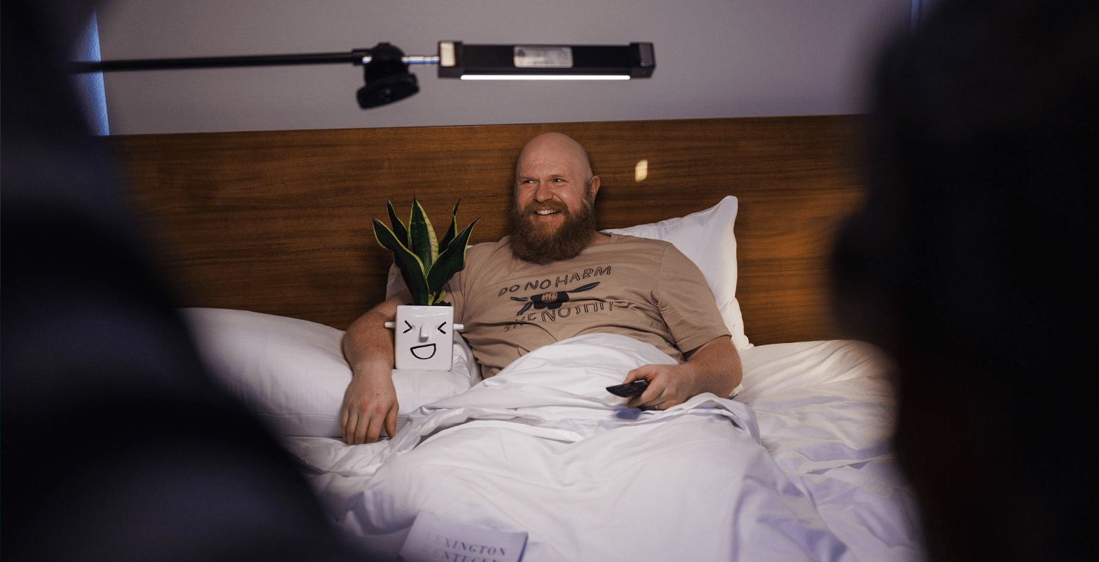 man in hotel with plant